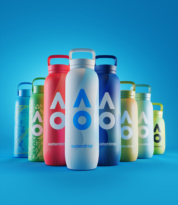 Set of colorful reusable water bottles arranged on a blue background.