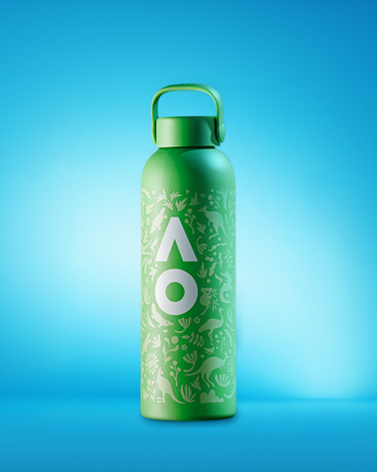 Green reusable water bottle with a leafy pattern and a handle-cap on a blue gradient backdrop.
